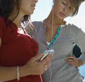 42-17685882 - Friends Sharing Headphones