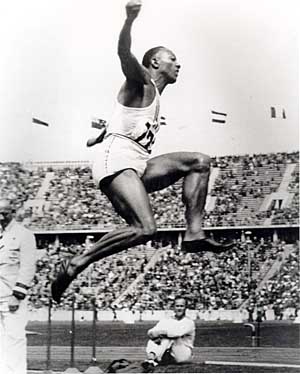 Jesse Owens competes in the long jump